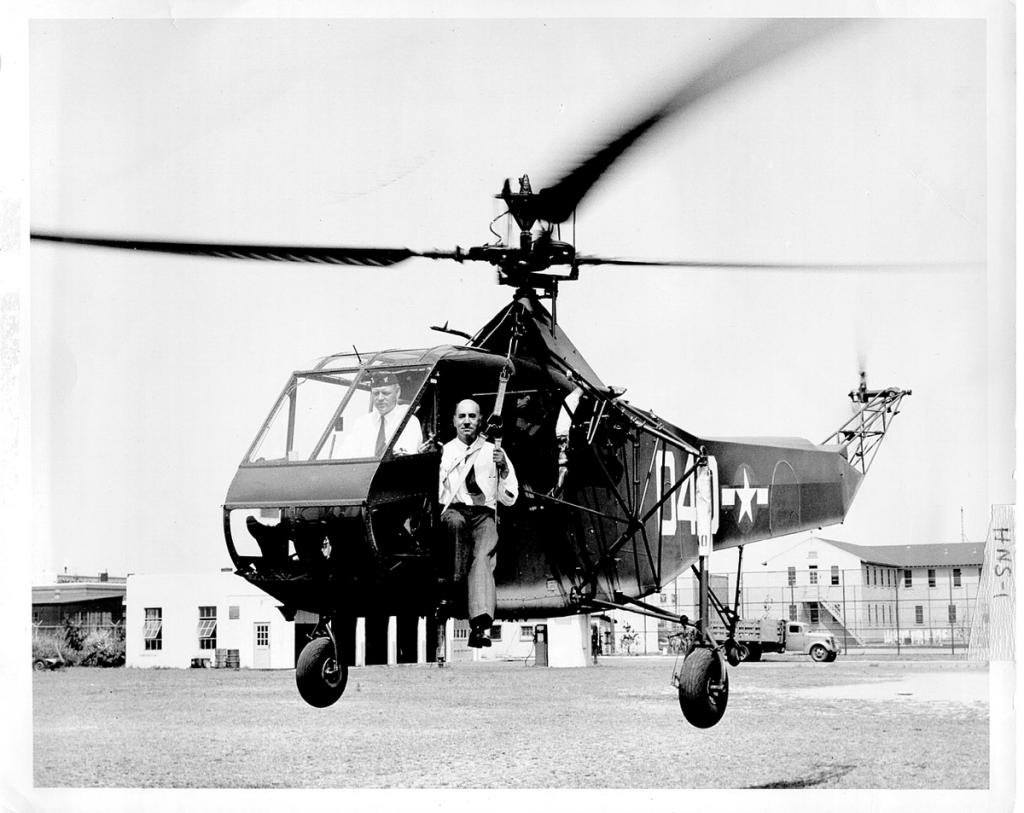 Sikorsky's production R-4B helicopter. Igor Sikorsky is sitting on the harness in the doorway