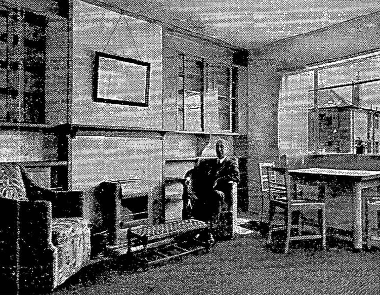 Viscount Weir sits by the fireside in the Sighthill Paragon House